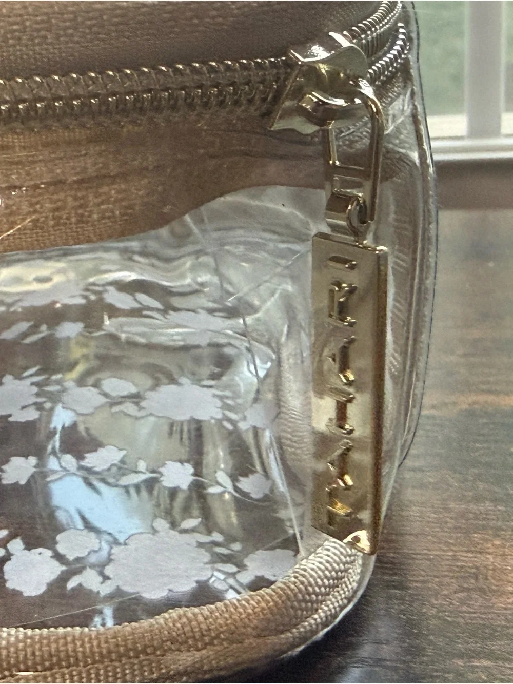 Tahari Clear Cosmetic Bag with Beige Trim and Purple Floral Pattern